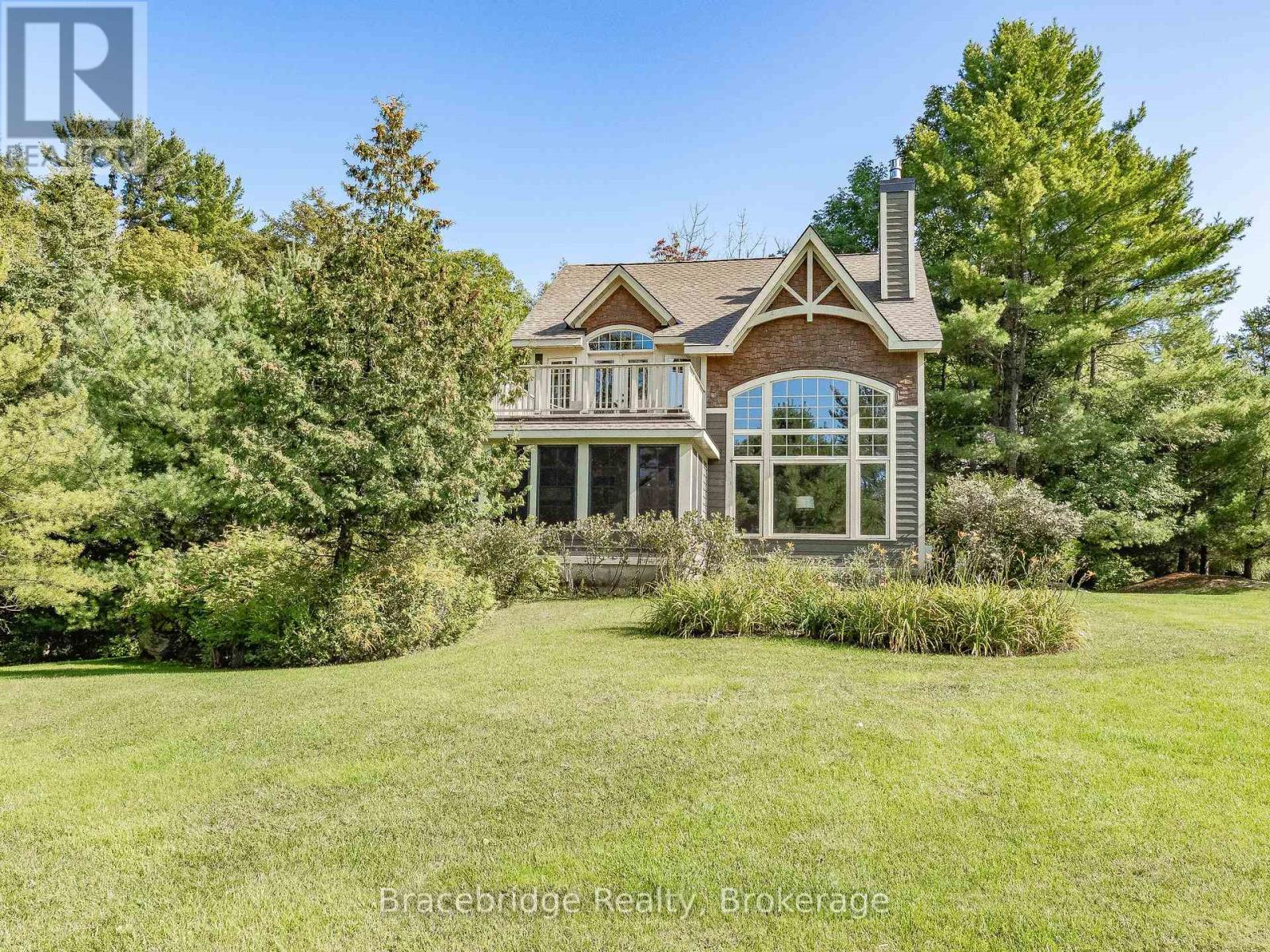 Sandfield 8 W4 - 3876 Muskoka Rd Hwy 118 W, Muskoka Lakes, Ontario  P0B 1J0 - Photo 1 - X12027702