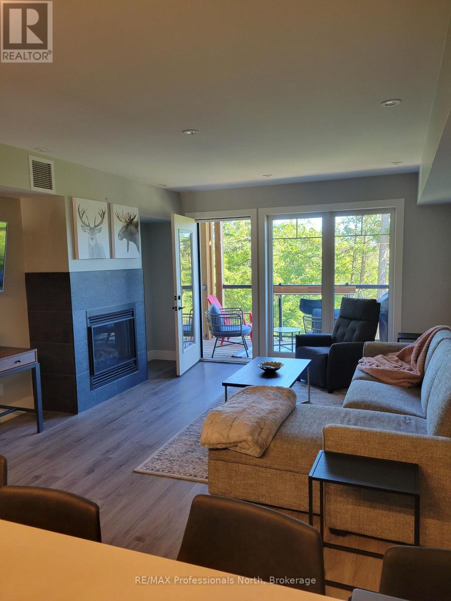 202 - 3 Tree Tops Lane, Huntsville, Ontario  P1H 1A9 - Photo 1 - X12245315
