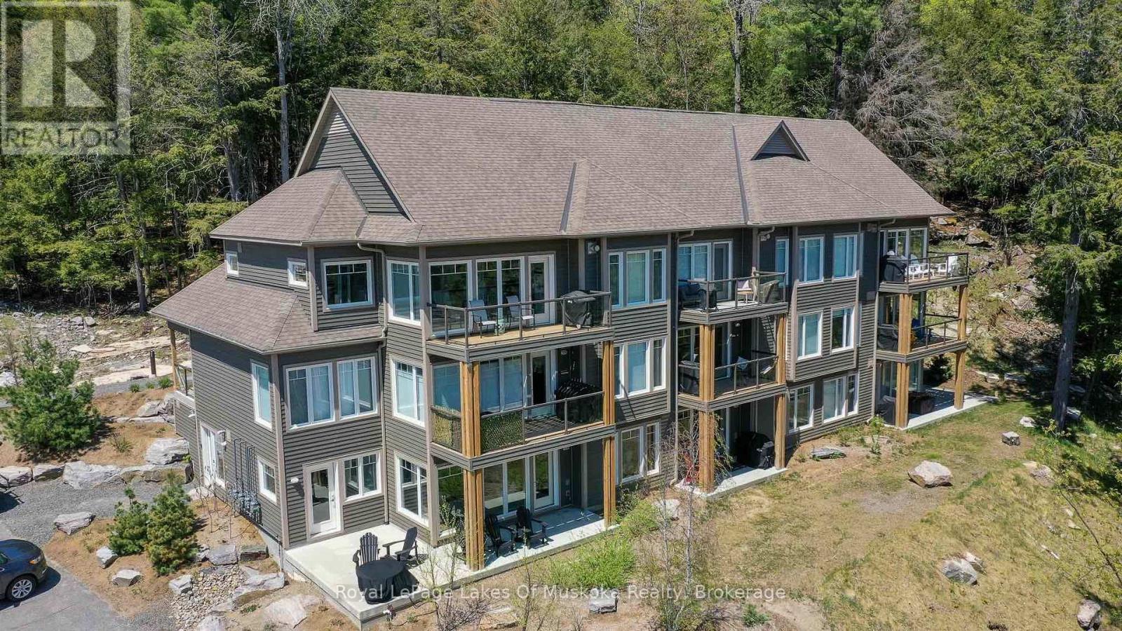 102 - 3 Tree Tops Lane, Huntsville, Ontario  P1H 0B8 - Photo 2 - X12348899