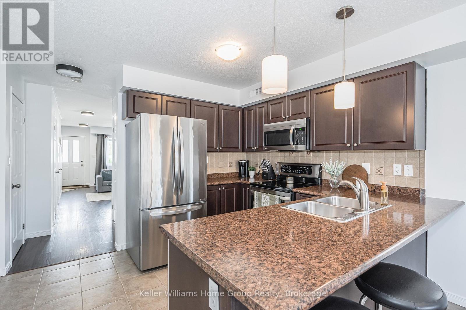 57 - 35 Mountford Drive, Guelph, Ontario  N1E 0G6 - Photo 4 - X12952554